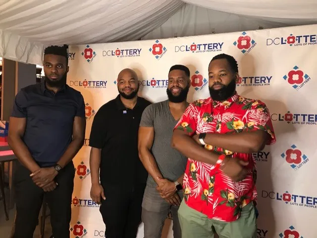 Four gentlemen posing for a photo
